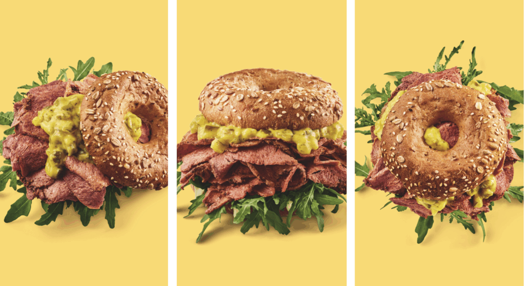 Ab 1. September 2025 gibt es in den 95 Burgergrill-Restaurants von Hans im Glück den rein pflanzlichen planted.pastrami Bagel.